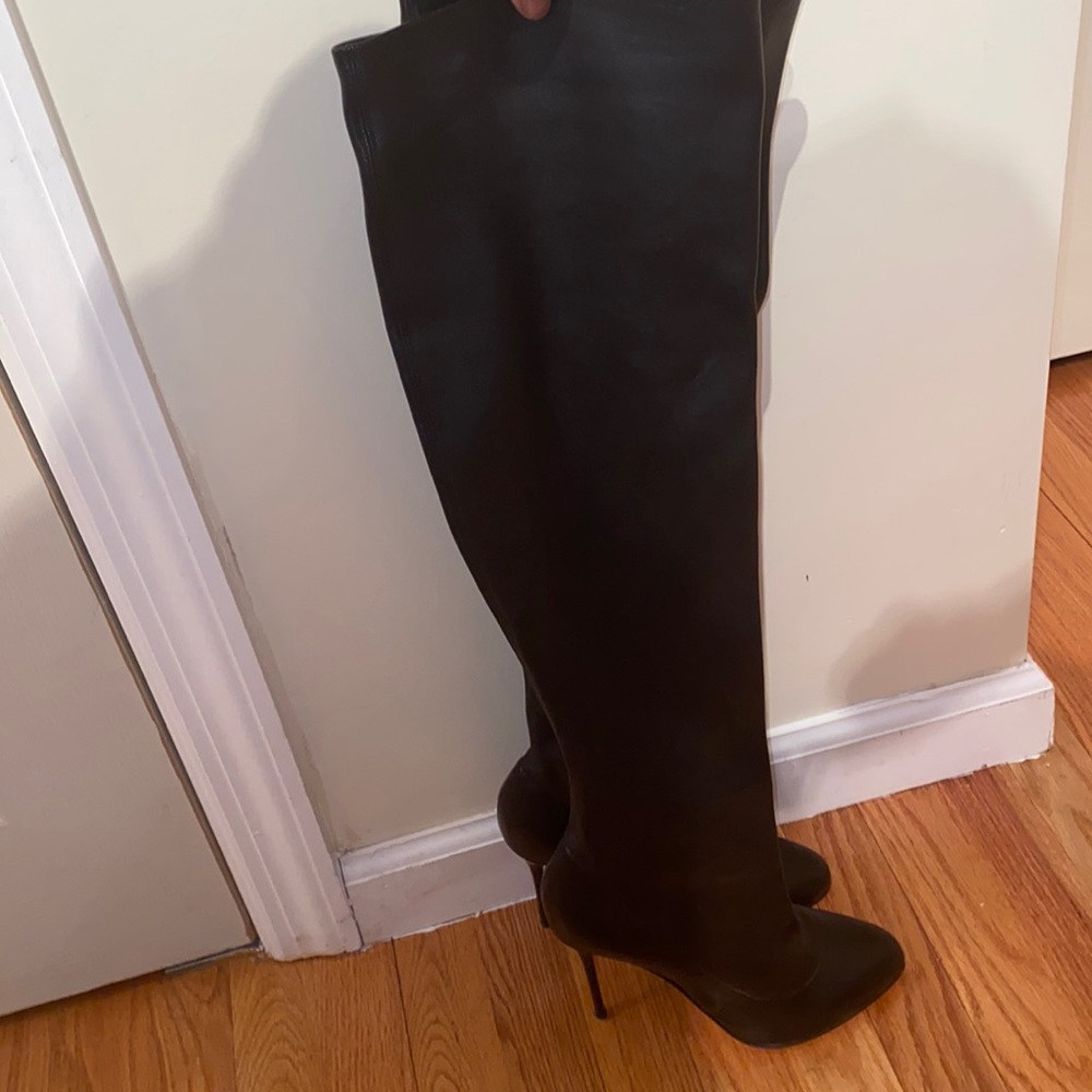 Knee high louboutin boots